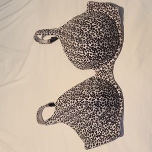 Off-white bra covered in black floral print